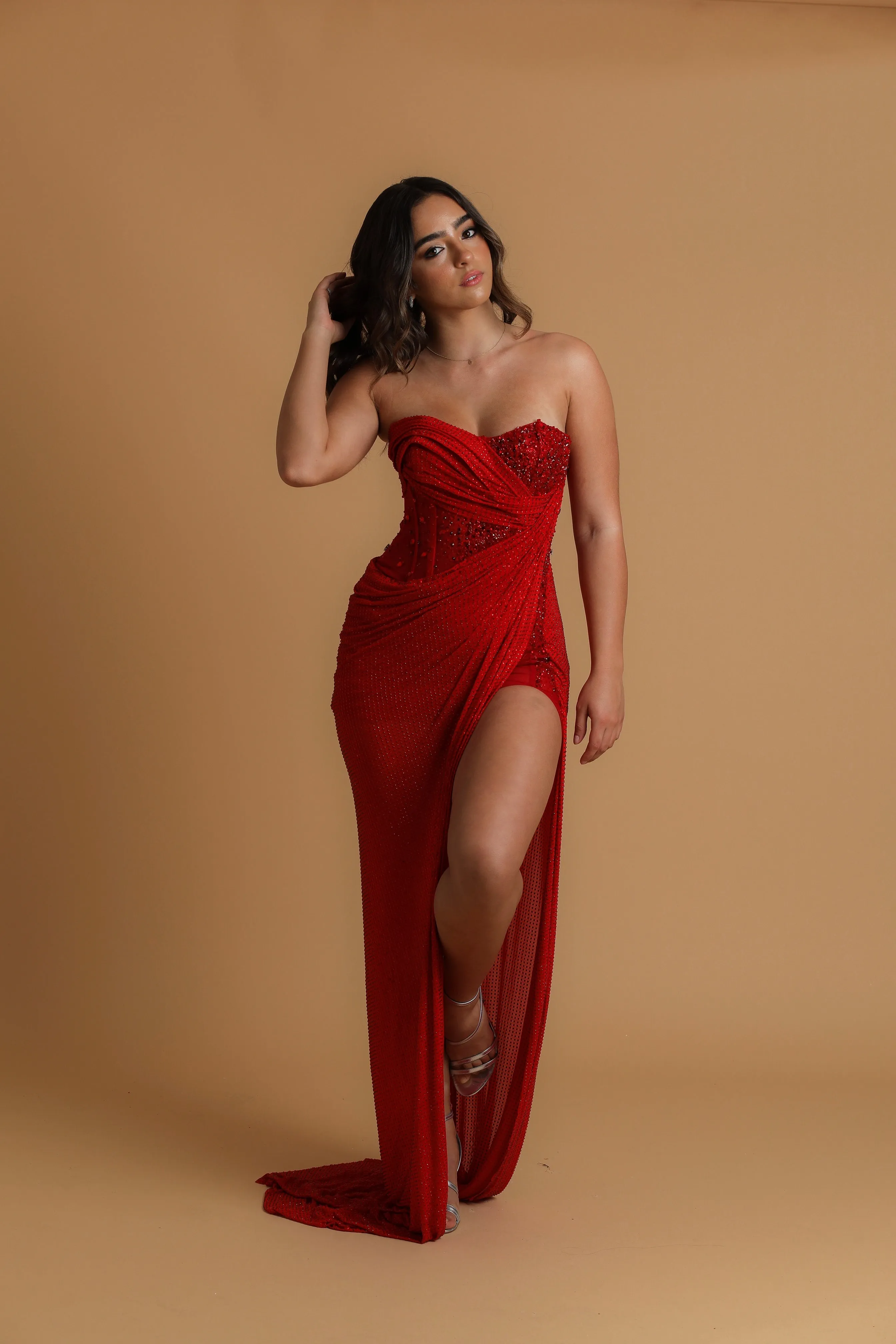 Red satin column shaped dress with  and high slit for hire
