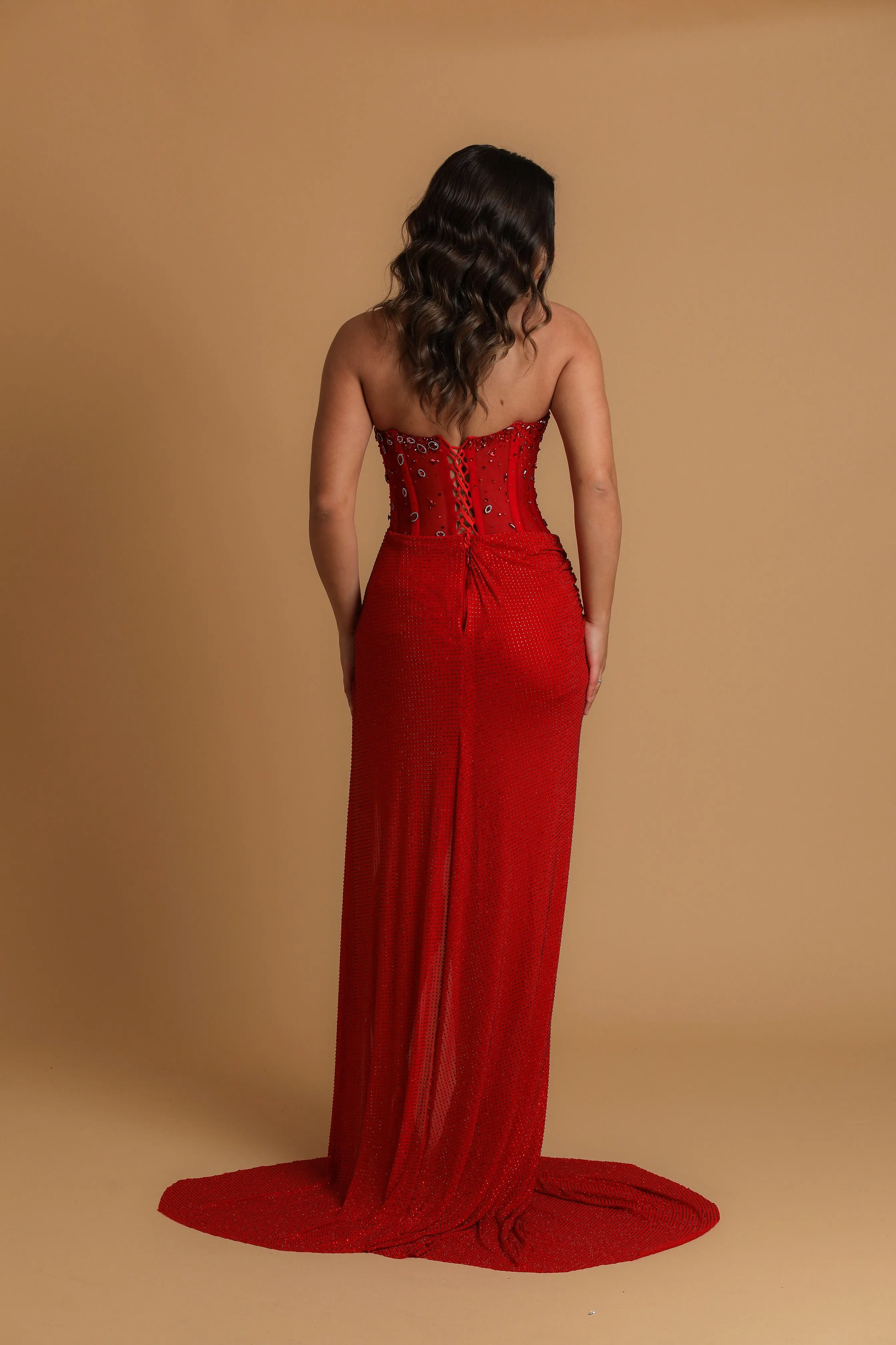 Red satin column shaped dress with  and high slit for hire