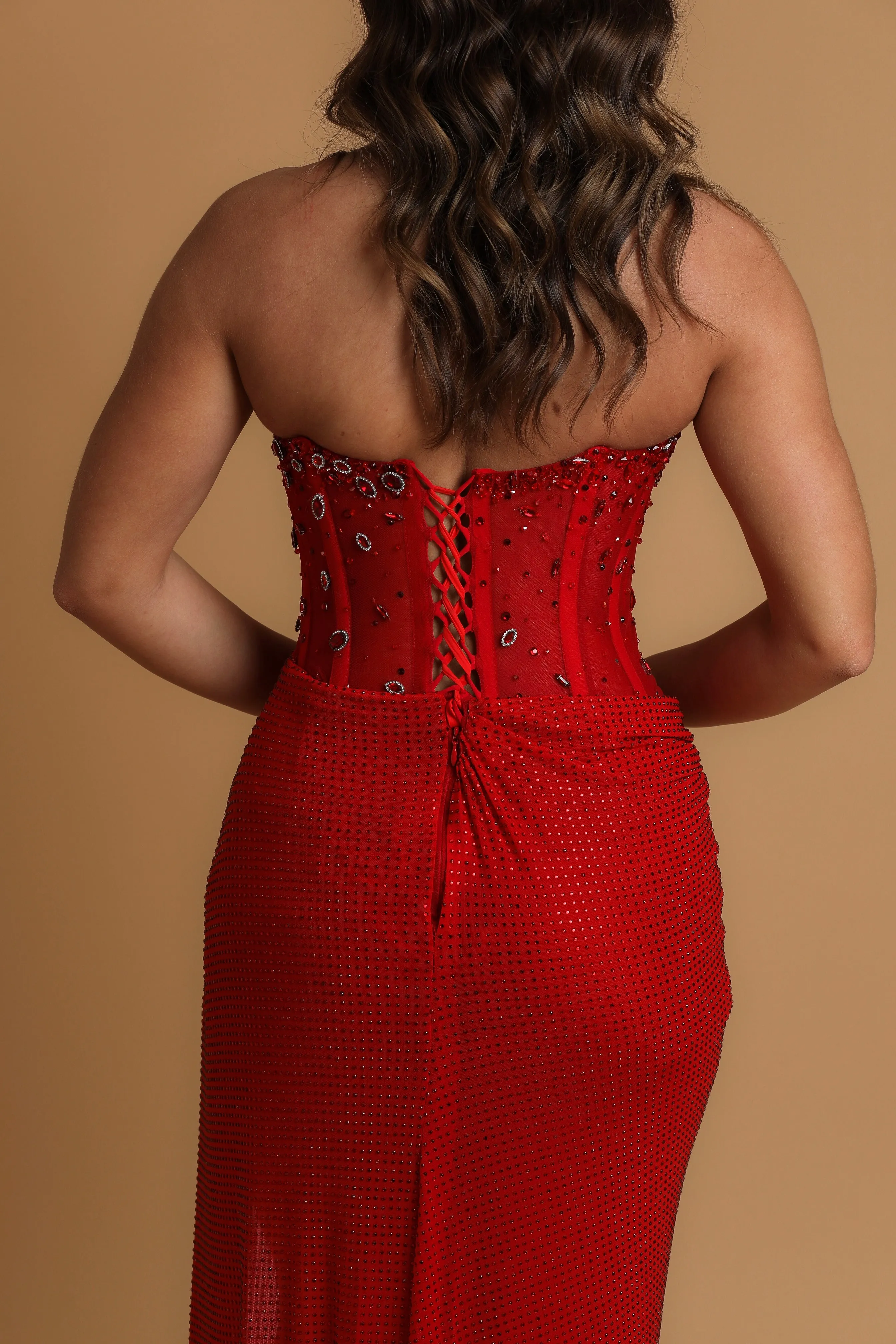 Red satin column shaped dress with  and high slit for hire